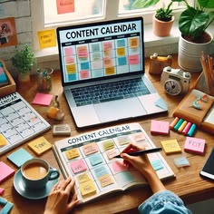 Content creator planning a social media content calendar using a laptop, notebook, and scheduling planner for consistent posting.
