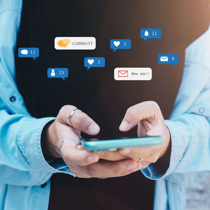 Business owner responding to social media comments and messages while engaging with followers to build an active online community.